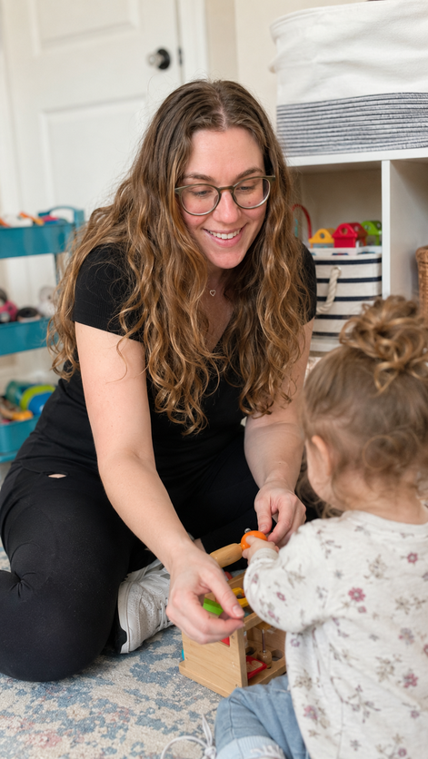 Danielle playing with a toddler and wooden toys
